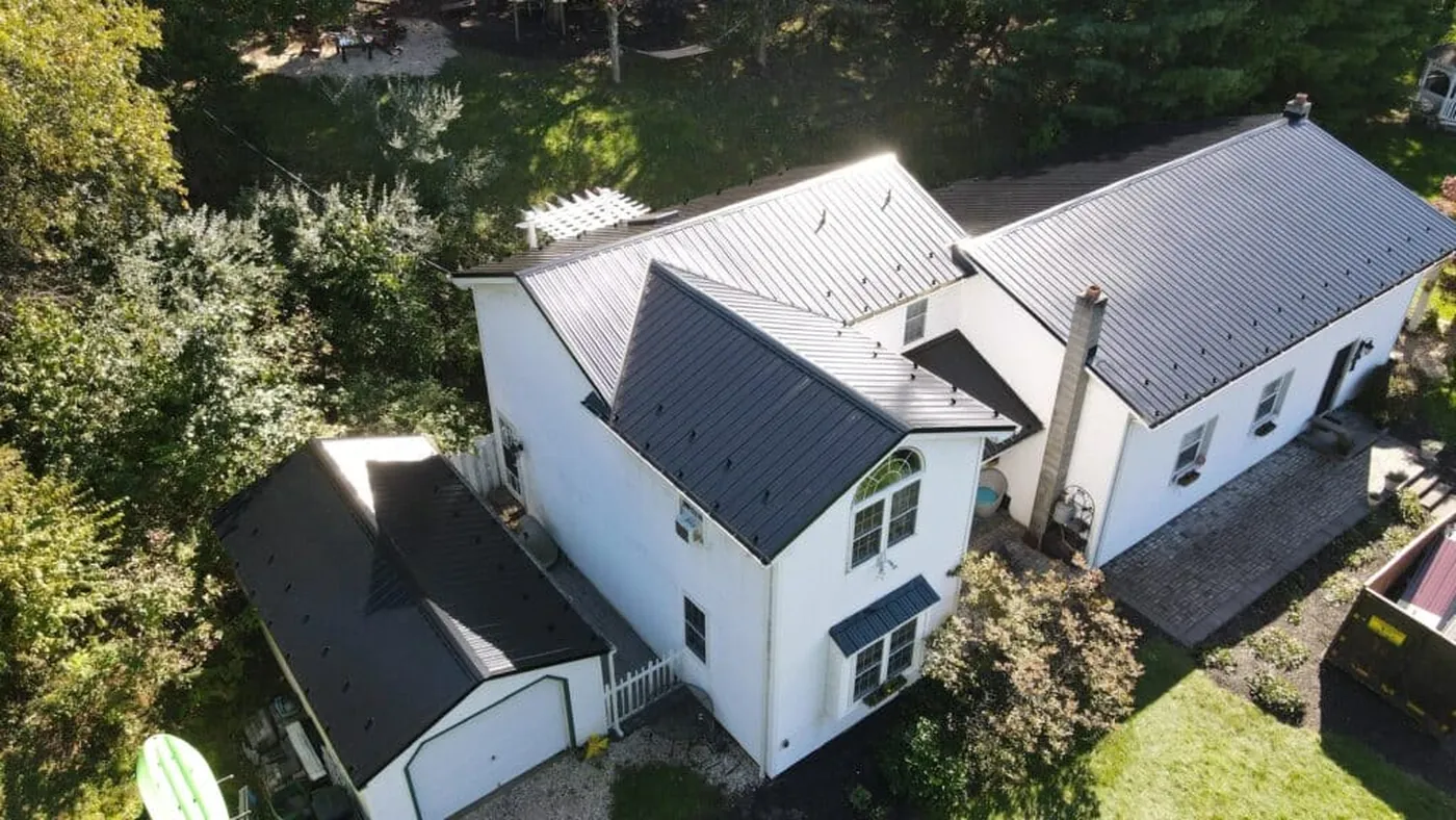 Aerial view of a multi-level dark metal roof