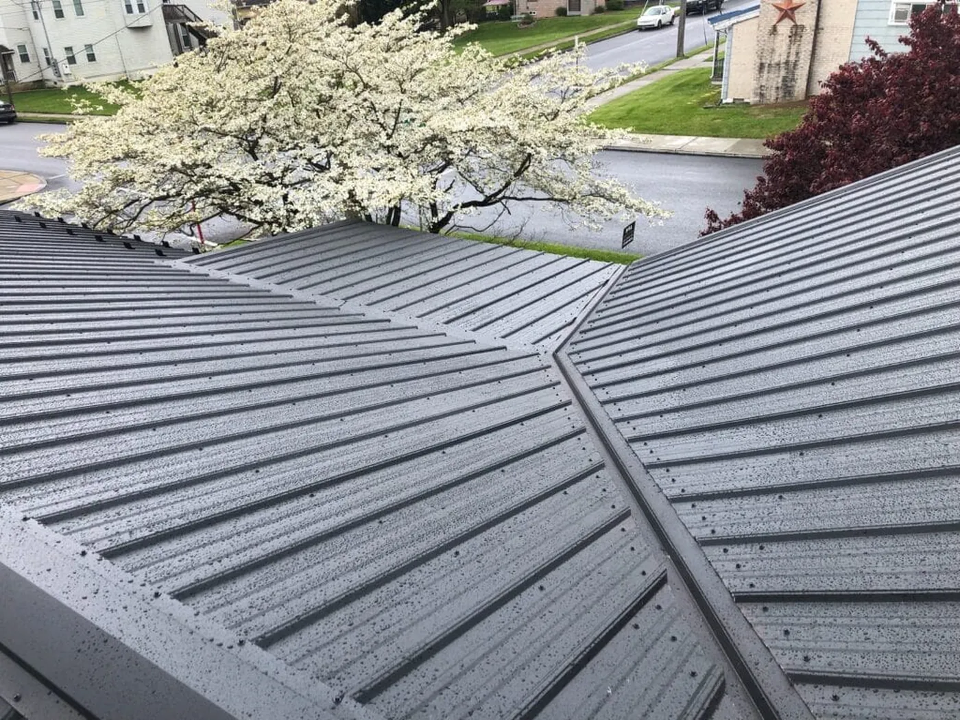 Close view of dark standing-seam roof panels