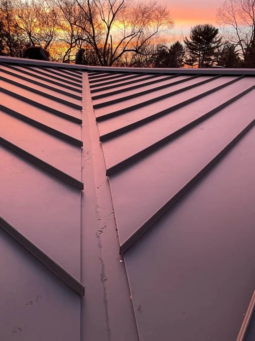 Close view of a metal roof ridge and flashing detail