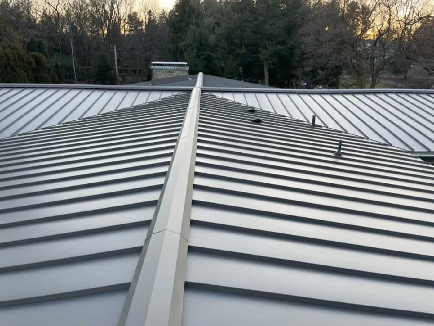 Finished standing-seam roof panels and ridge