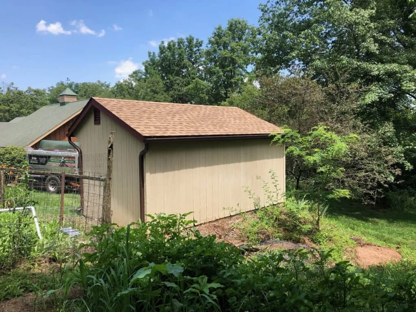 Small outbuilding with a tan roof in the project gallery