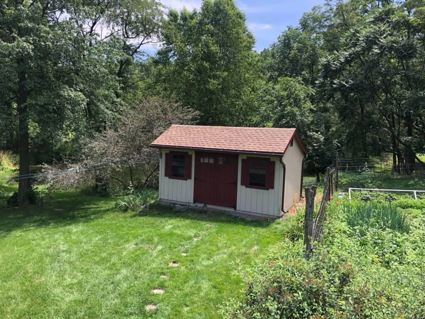 Small outbuilding with a red roof in the project gallery