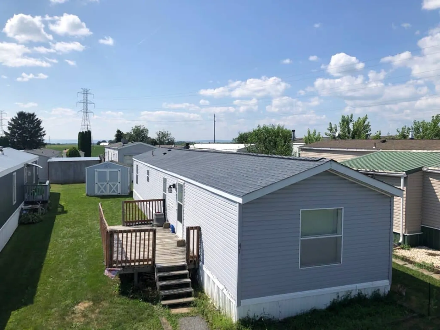 Aerial view of a light gray metal roof on a manufactured home