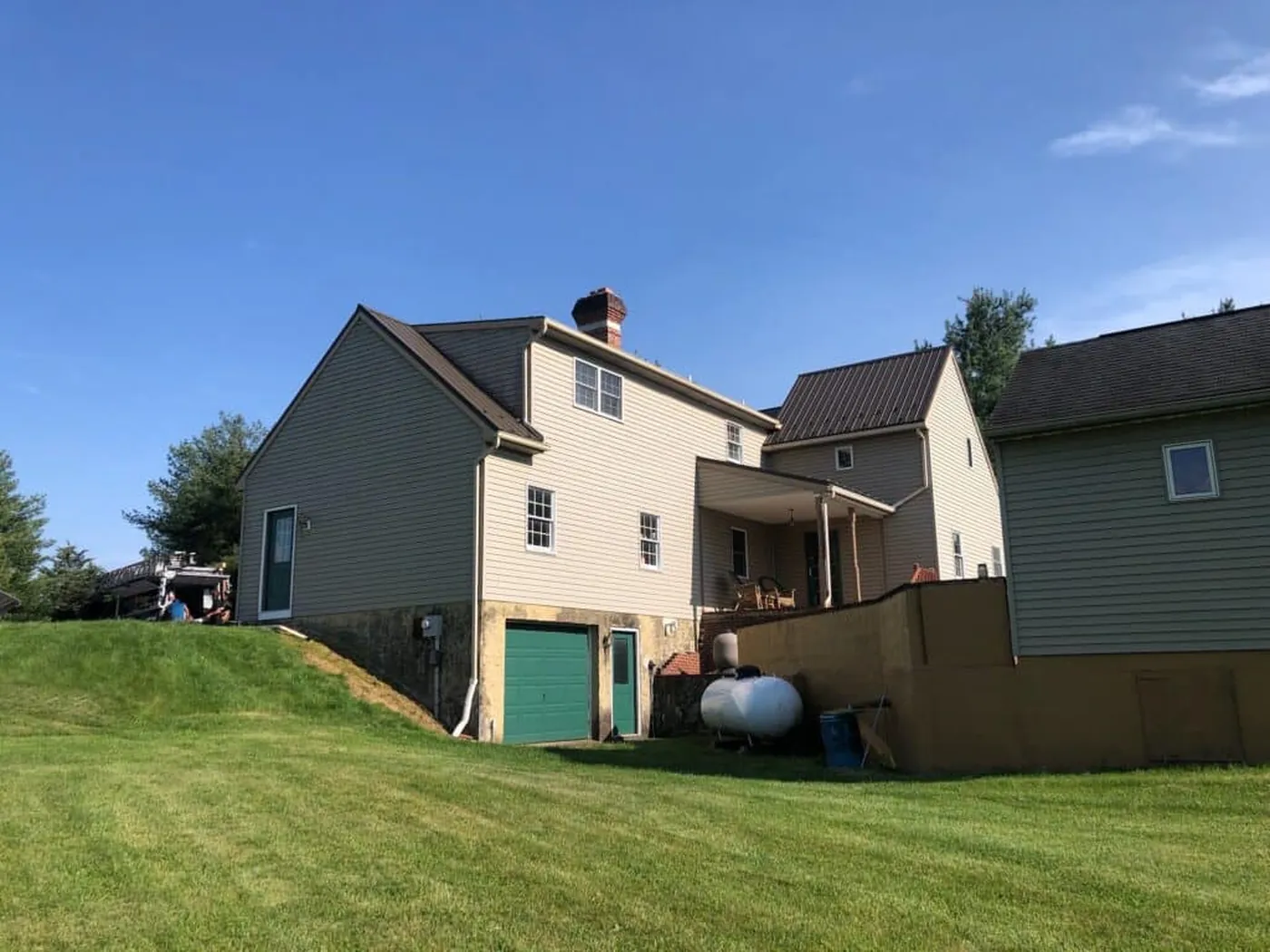 Side view of a home with a dark metal roof