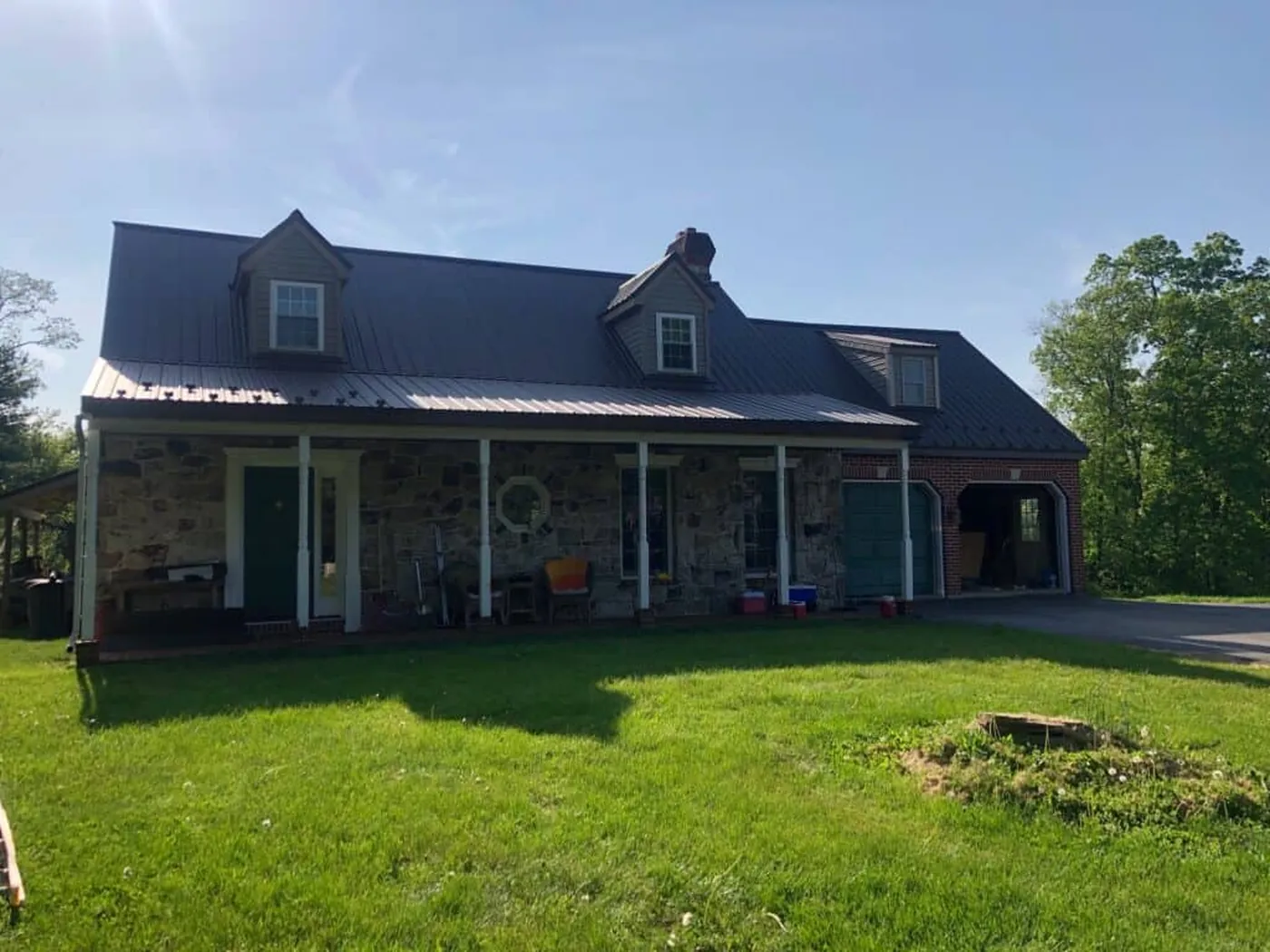 Front view of a single-story home with a dark metal roof